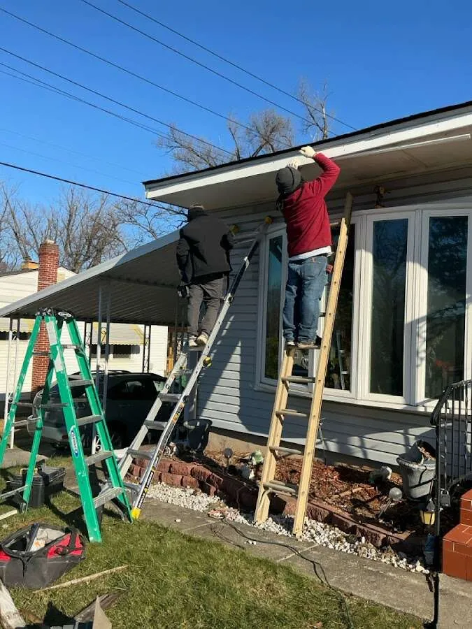 Restoration crew performing exterior repair in Olyphant